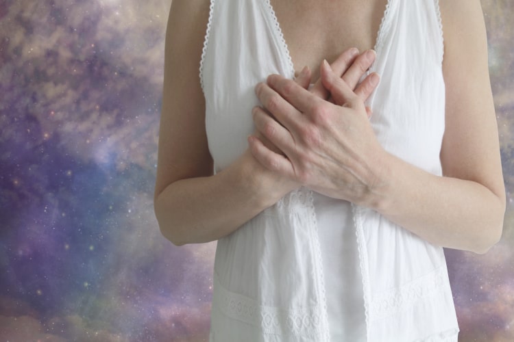 woman holding her heart-being an empath