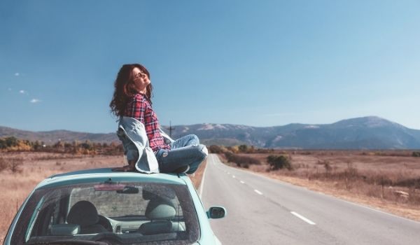 woman alone for Christmas on a car