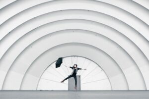 woman with umbrella-self discovery questions blog