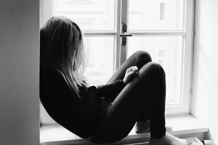 sad girl sitting alone-asking for help blog