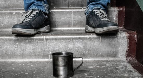 empty mug on stairs-how to help the homeless