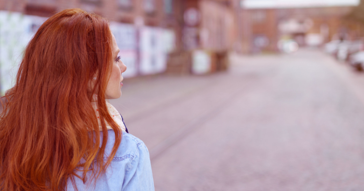woman with long red hair walking away-just move on quotes blog