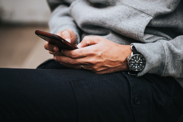 man holding phone texting