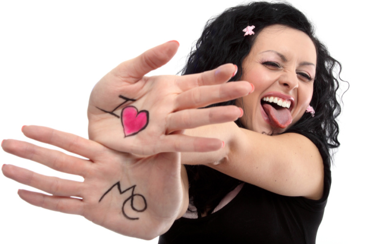woman with writing on hands I love me-how to practice self compassion blog
