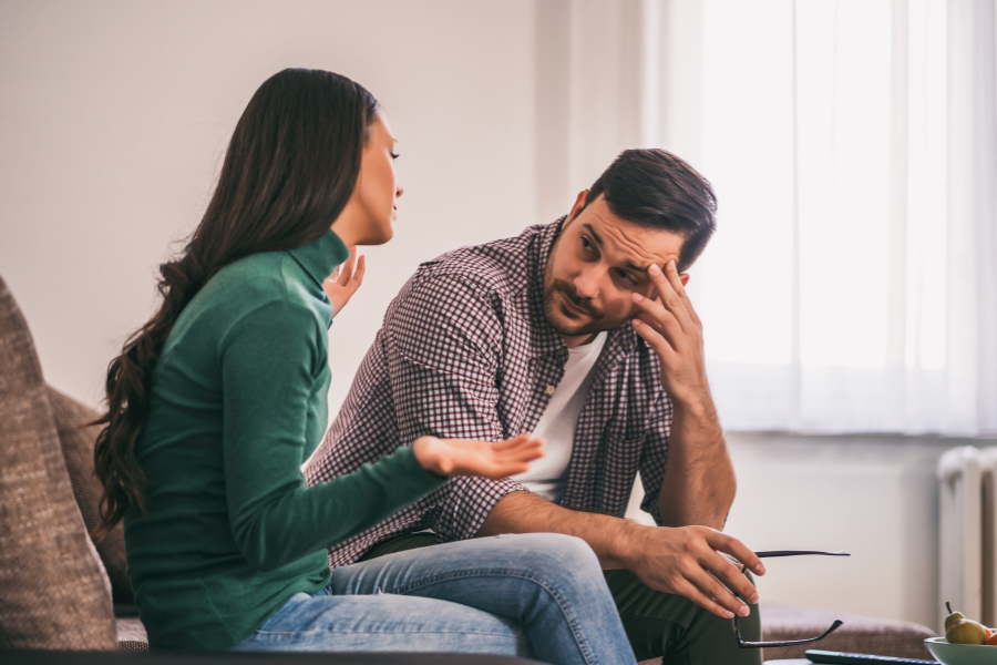 A couple talking about "what does it mean to be clingy?"