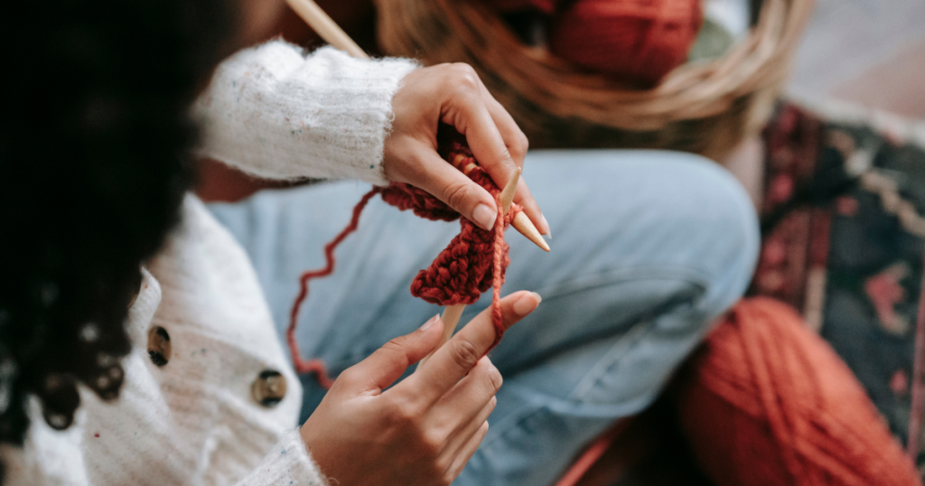 A person knitting for creative self-expression
