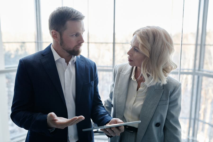 Two employees communicating