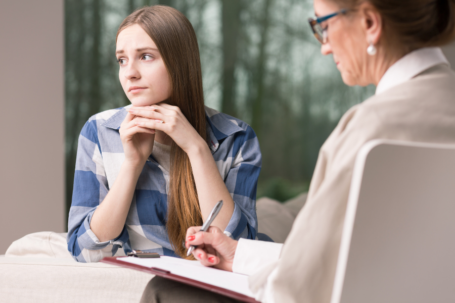 A lonely woman talking to a professional