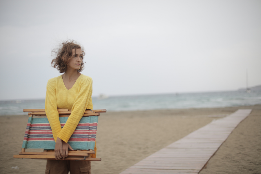 A woman at the beach with low self confidence