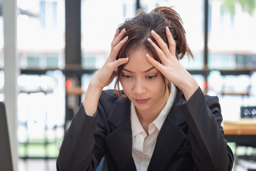 A woman experiencing work burnout