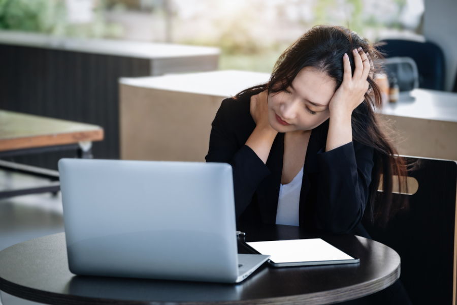 A woman experiencing work burnout