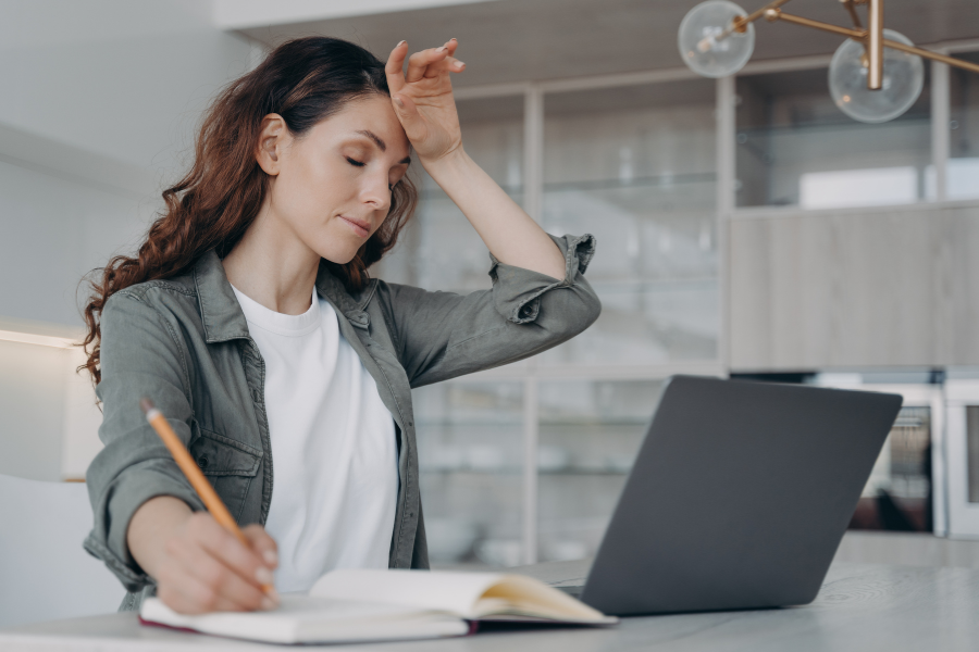 A woman experiencing work burnout