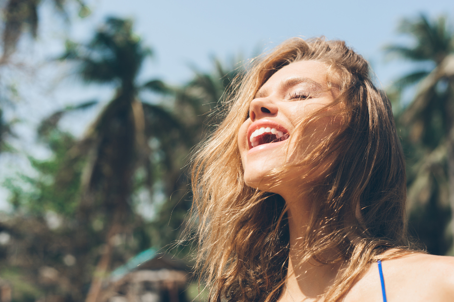 A woman who's happy because she learned about life areas for goal setting