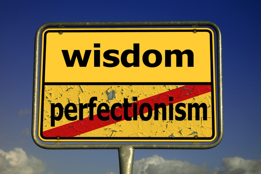 A sign that says perfectionism is not the way to go