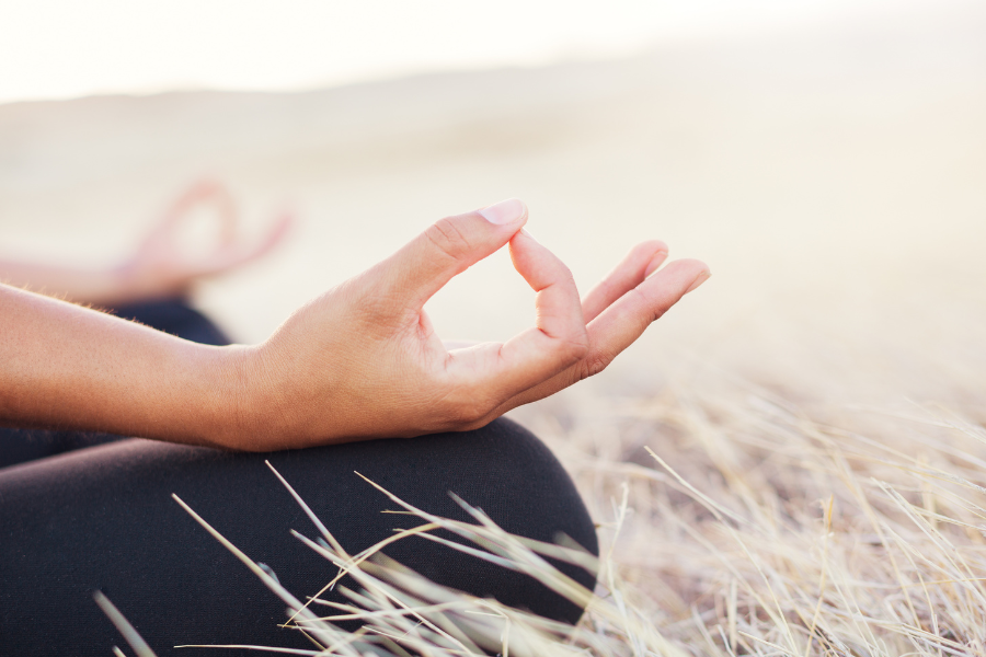 A photo of a hand doing the meditation sign