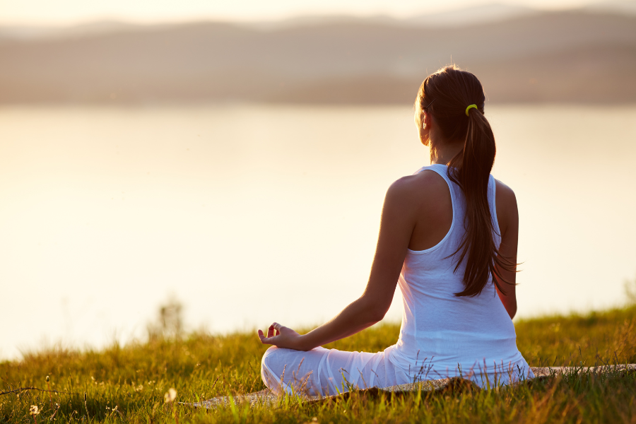 A woman meditation to decrease stress in life