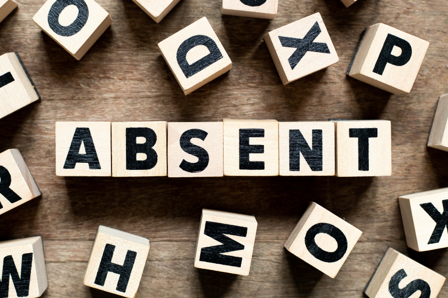 A scrabble set spelling "absent" #WorkplaceDepression #Depression