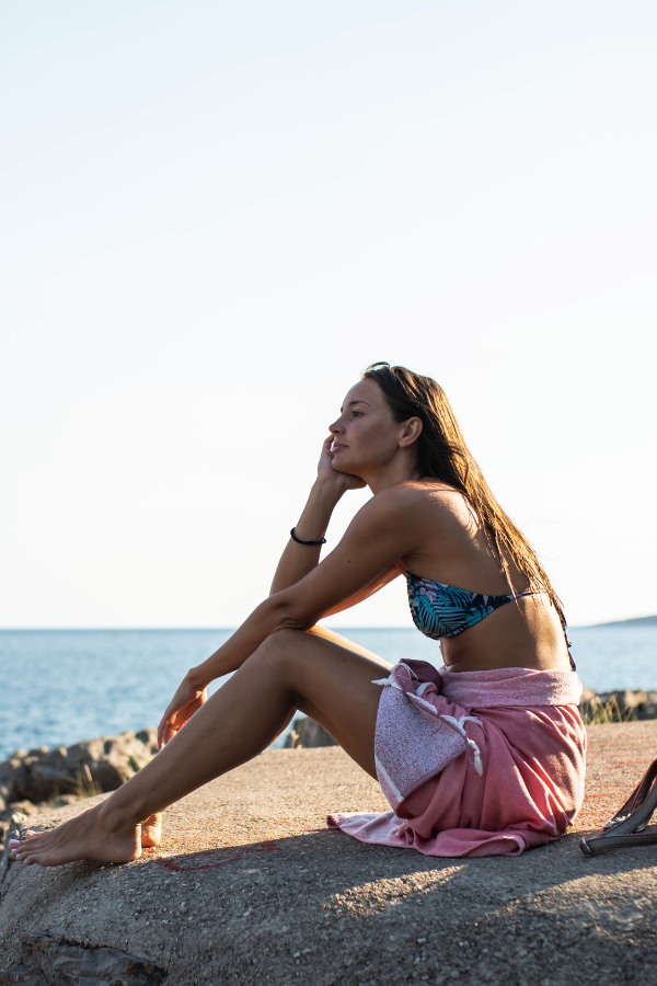 A woman relaxing at the beach #MentalToughness #StrongMind