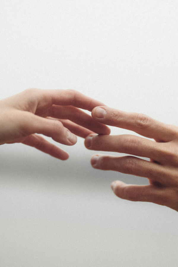 Two people barely touching each others' hands #MentalHealth #MentalWellbeing