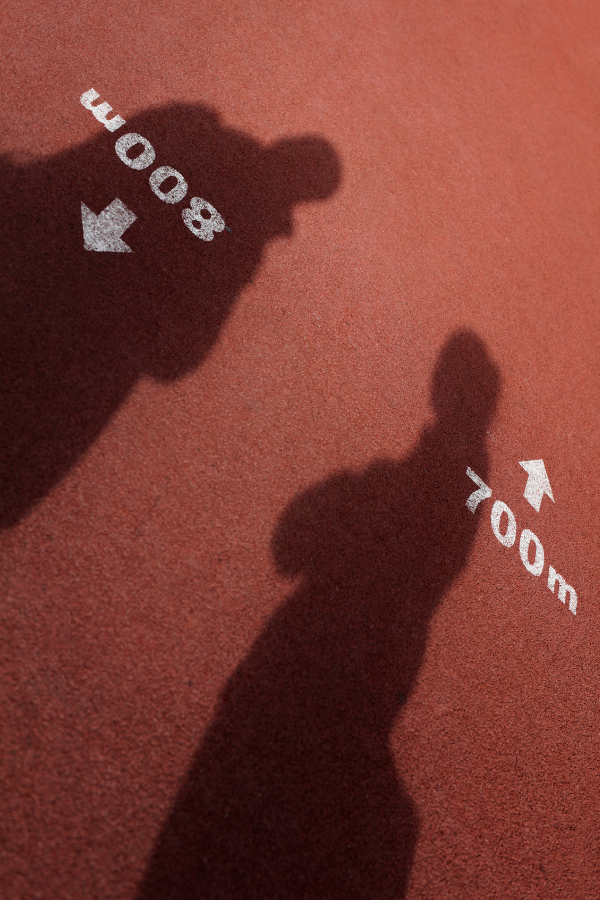 Two people's shadows in a track field #RelationshipBoredom #Relationship