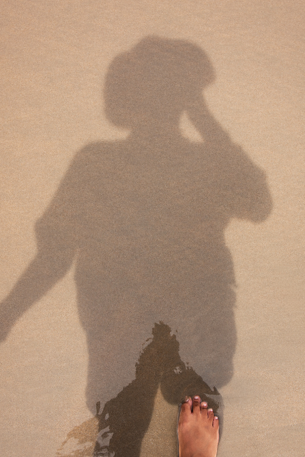 A person looking at their shadow on the beach #EmotionalIntelligence #BetterHabits