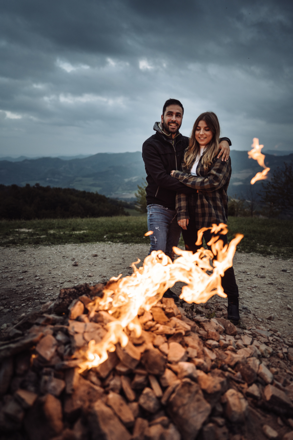 A happy couple hanging out by the fire #MentalHealth #RelationshipTips