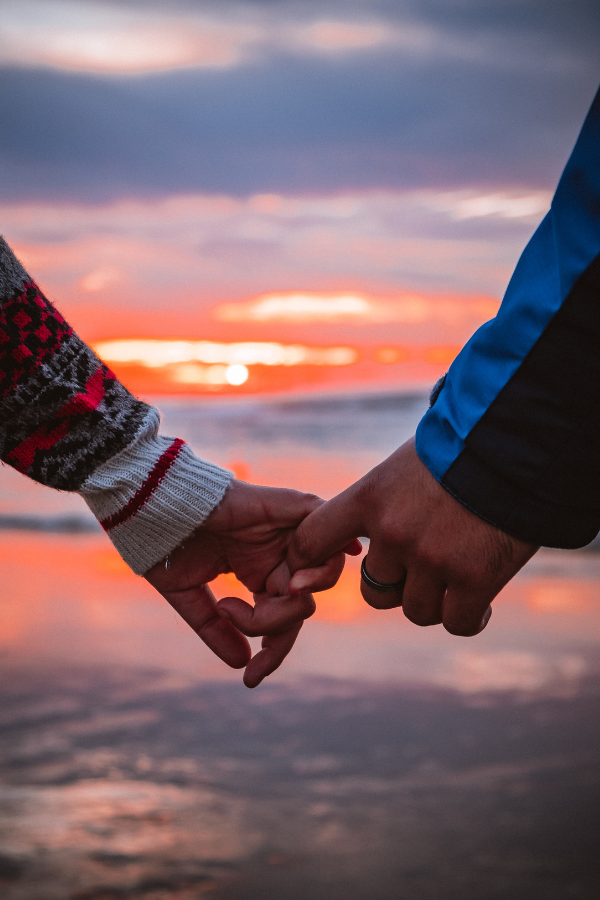 A couple holding each others' hands #RelationshipBoredom #Relationship