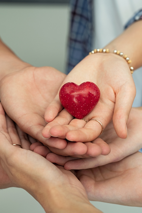 A couple holding a heart together to show compassion #MentalHealth #RelationshipTips