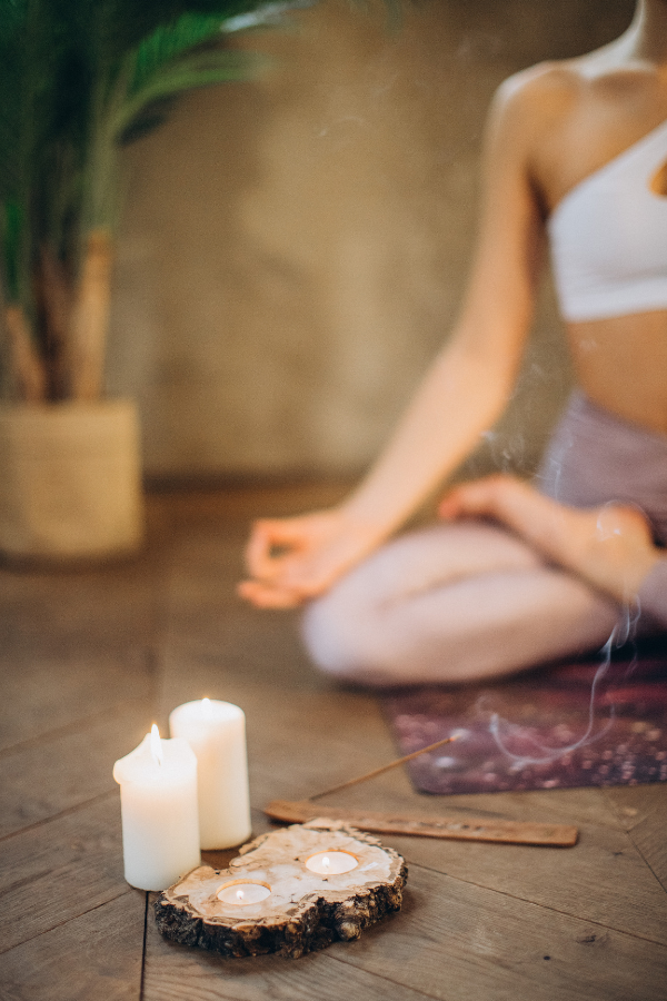 A woman meditating #OverwhlemedAtWork #WorkAnxiety