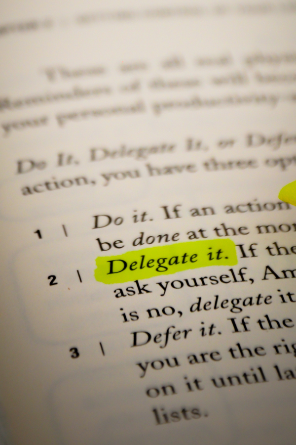 The phrase "delegate it" highlighted in yellow ink #OverwhlemedAtWork #WorkAnxiety