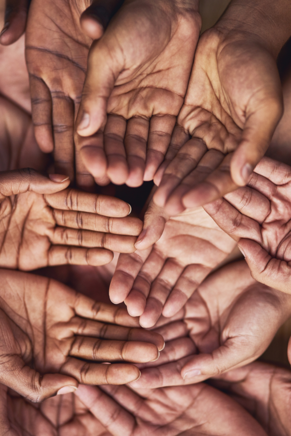 Lots of hands representing support #OverwhlemedAtWork #WorkAnxiety