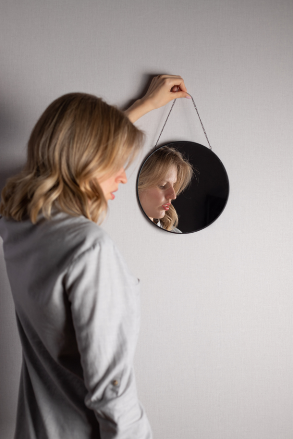 A woman showing her reflection in the mirror #TrustIssues #DealingWithTrustIssues