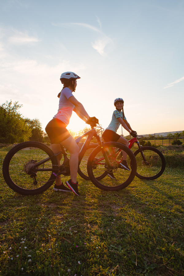 Two women riding bikes #MoveYourBody #MyBodyIsMyTemple