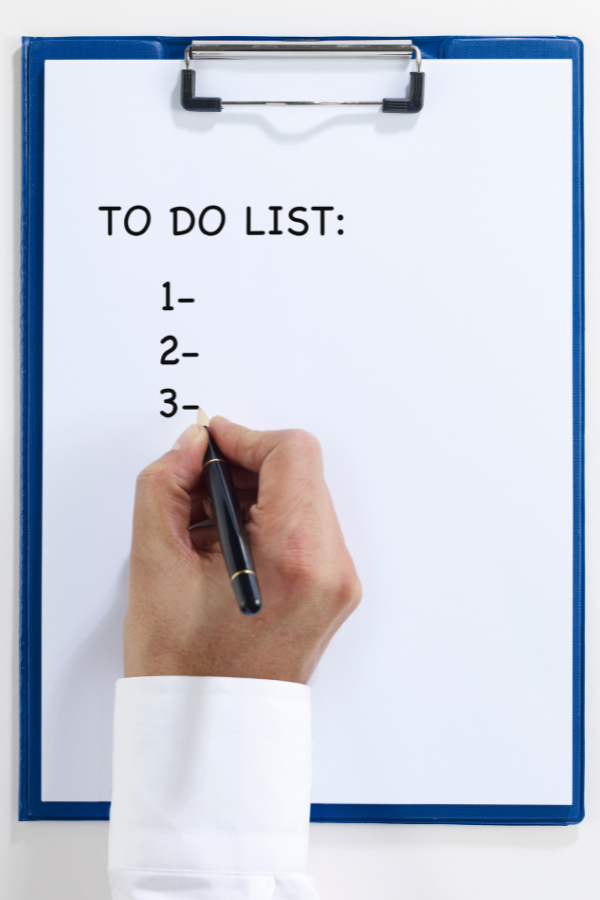 A person writing his to-do list #OverwhlemedAtWork #WorkAnxiety