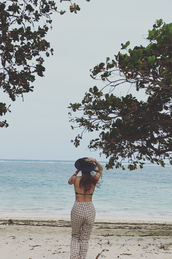 A woman standing by the beach #HowToBecomeStrong #StrongerAndBetter