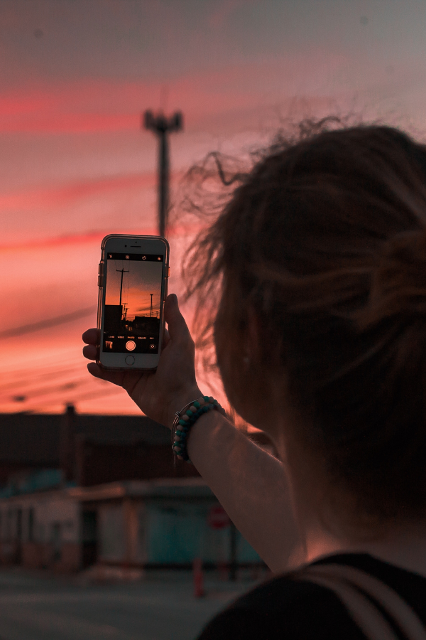 A woman taking a photo of the sky #RomanticizingLife #RomanticizieYourLife