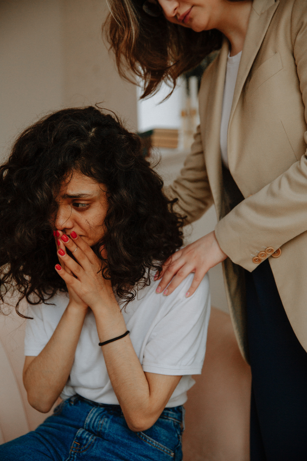 A woman being comforted by her therapist #BreakGenerationalTrauma #OvercomeTrauma