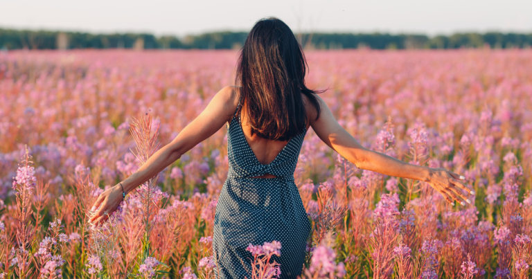 A woman walking through a field of flowers #RomanticizingLife #RomanticizieYourLife