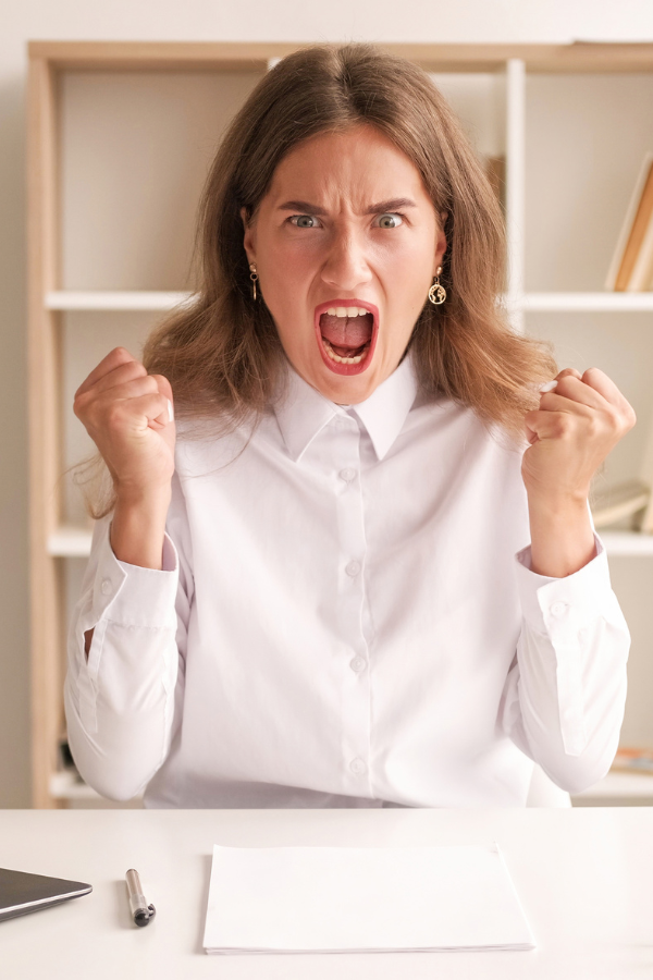 A woman feeling angry at work #LetGoOfAnger #SayNoToAnger