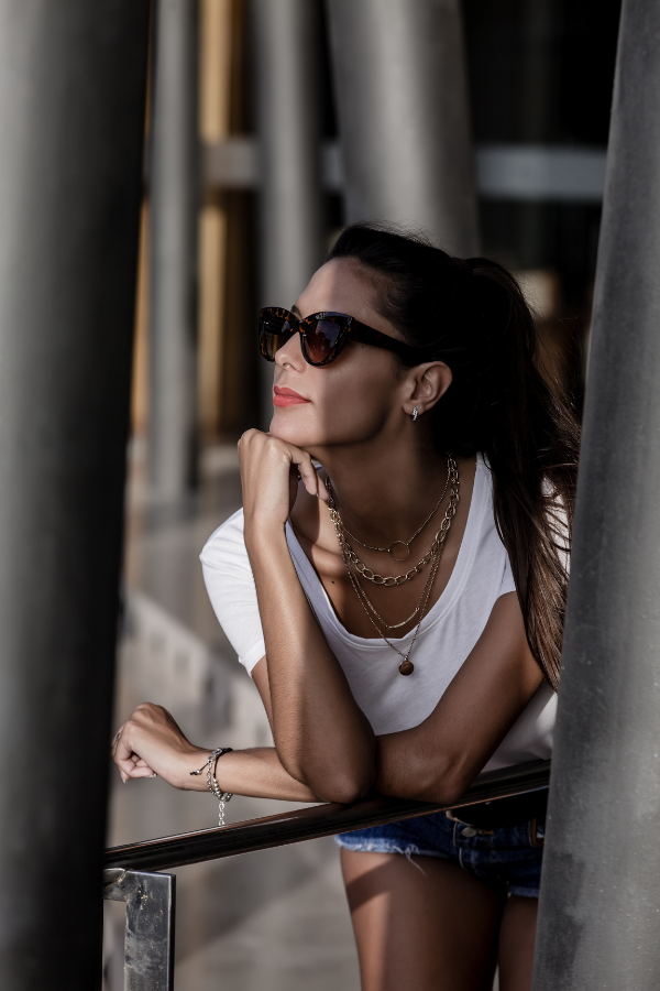 A woman wearing sunglasses in her magnetic energy