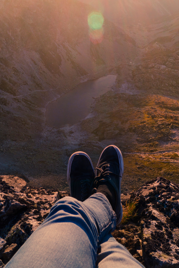 A hiker resting on top of the peak