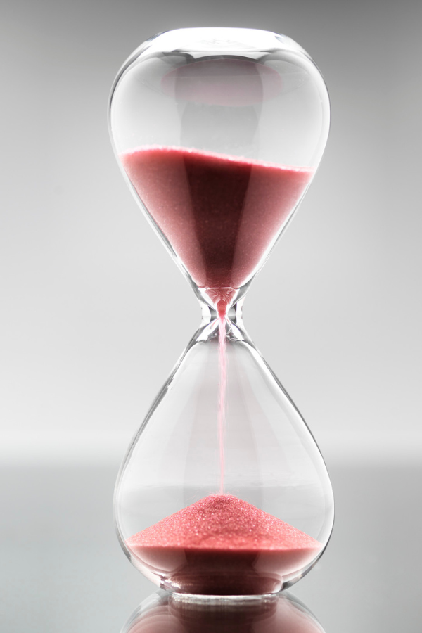 An hourglass showing that time is running out