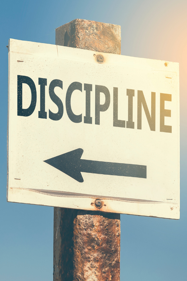 A road sign pointing towards dscipline