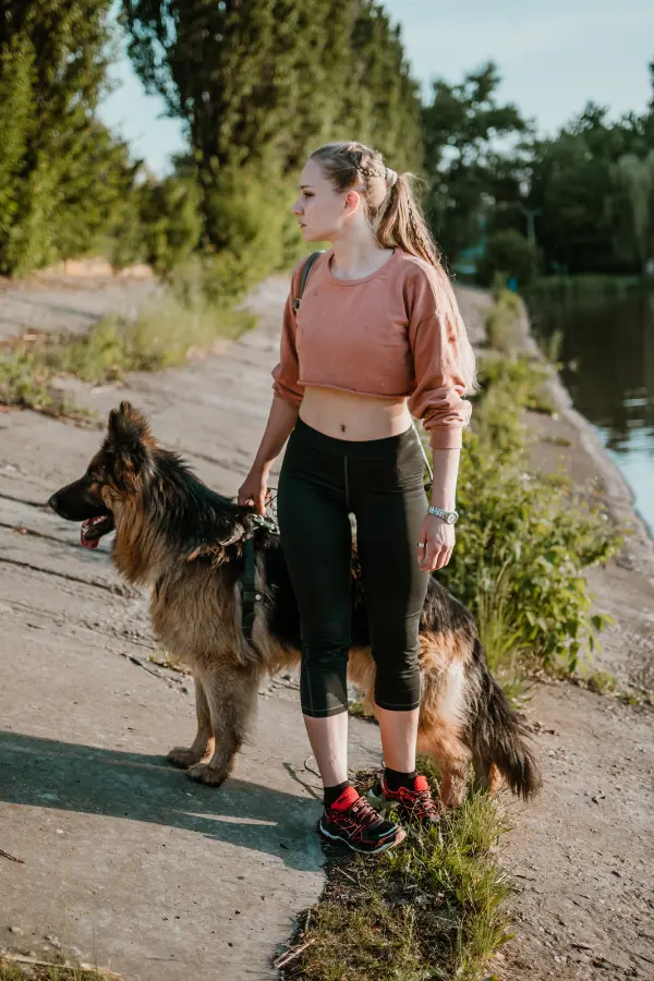A woman on a hike with her dog