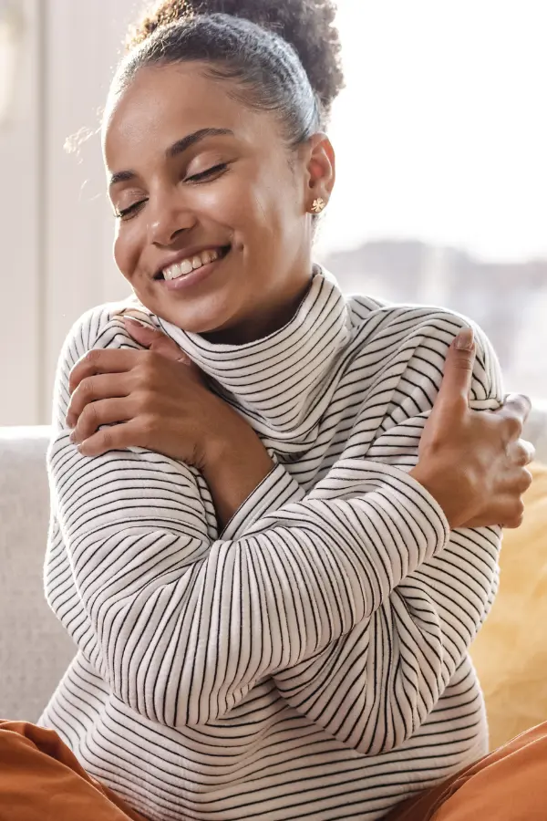 A woman hugging herself