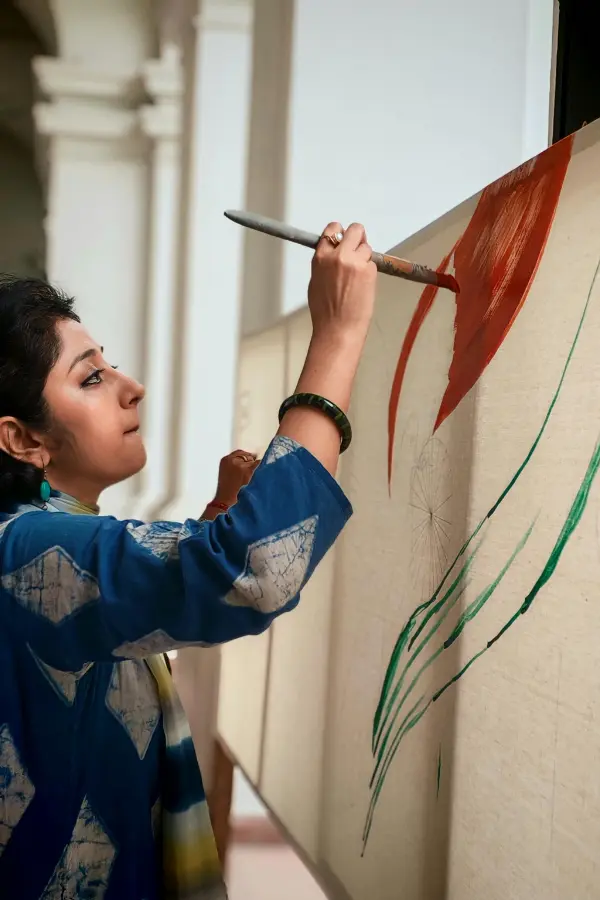 A woman painting passionately