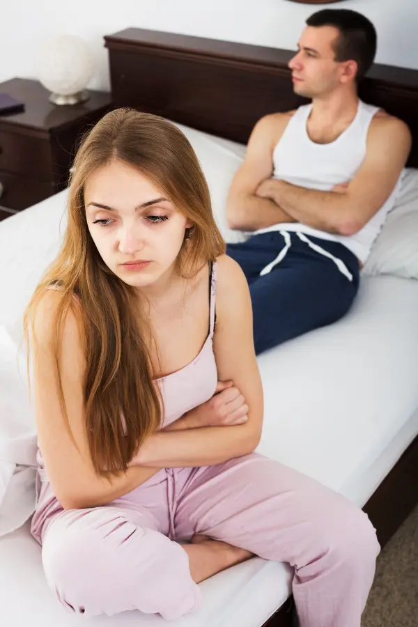 A man and woman in a fight