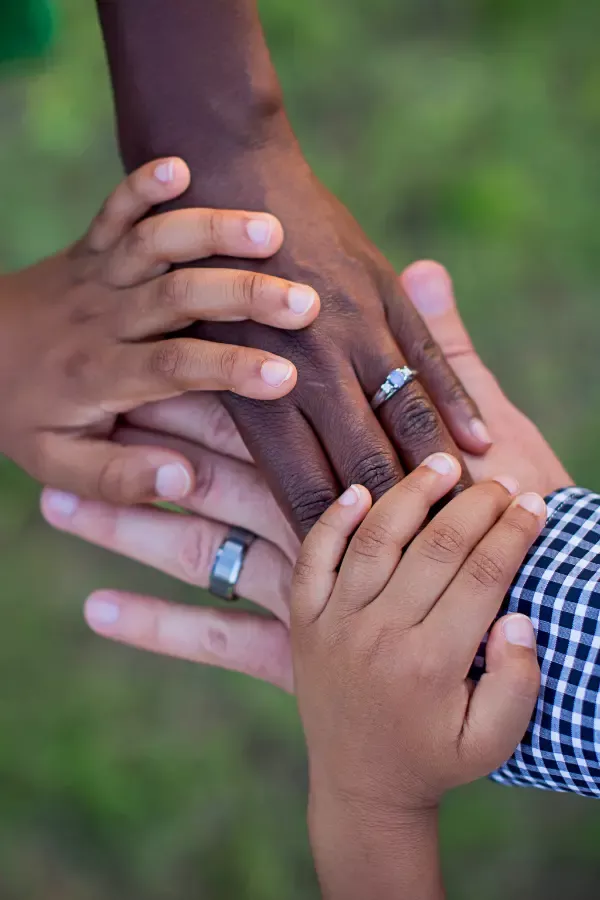 A family holding each others' hands