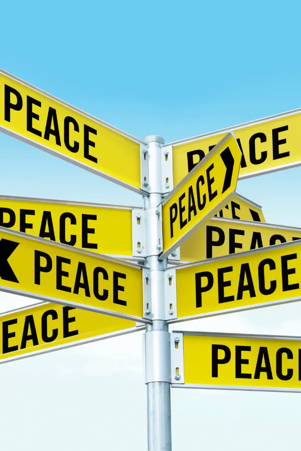 Road signs pointing toward peace