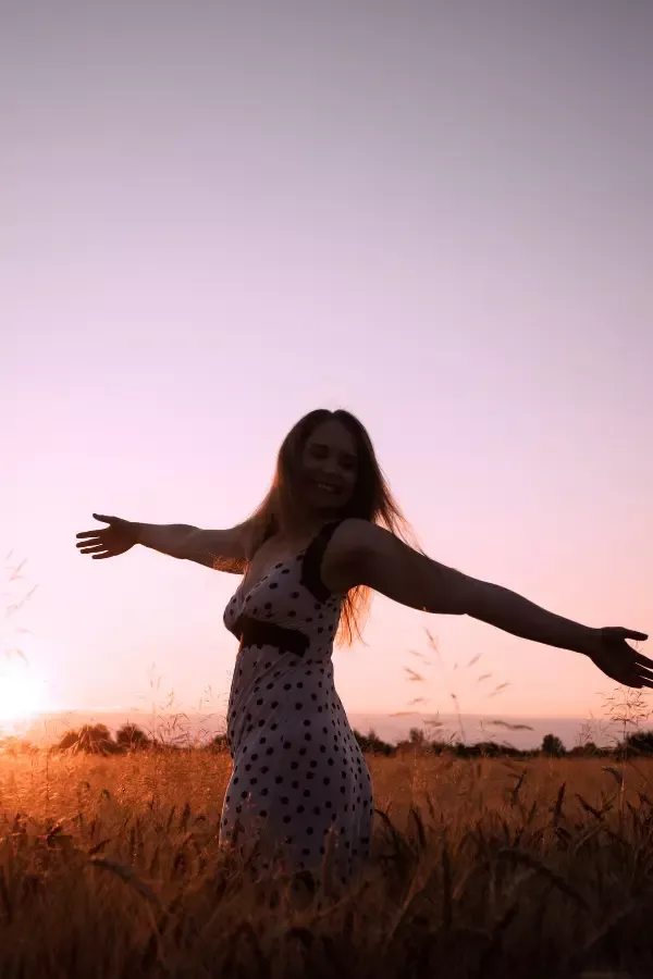 A woman dancing in a field